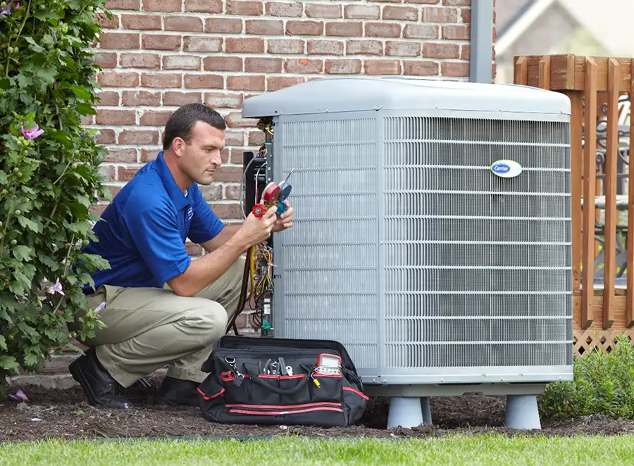 HVAC technician inspecting an outdoor air conditioning unit in Pleasant Grove